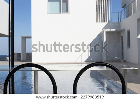 Luxury sea view swimming pool in modern white beach house