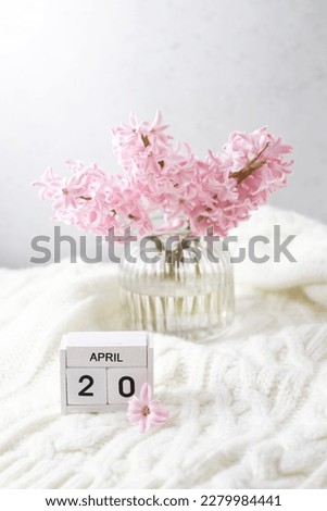 Pink hyacinth in vase and calendar date April 20. Included in the group of horizontal and vertical photos with all April dates