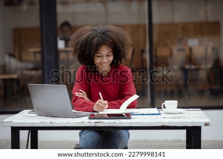 Young African American woman creative working at desk, Positive woman work hard.