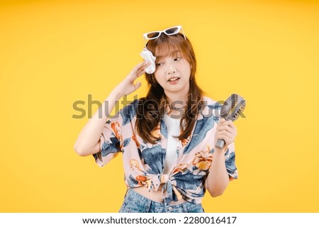 Asian Woman Feeling Hot During Summer Wiping Her Forehead