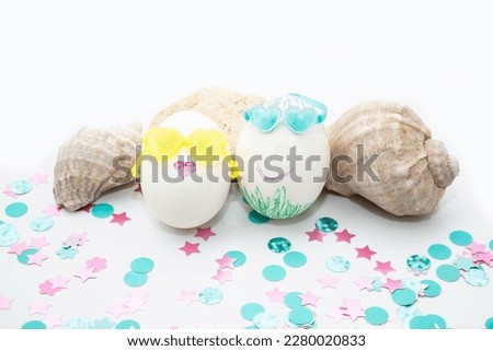 cute easter eggs in a white paper bag, isolated on a blue background. the concept of happy family