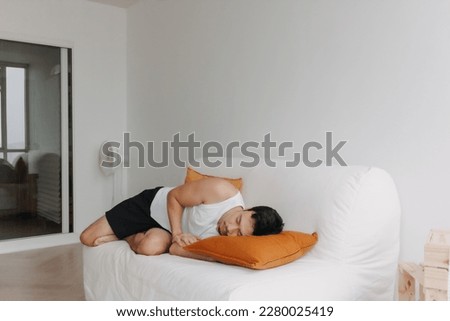 Asian man resting on the sofa in the afternoon as he tired.