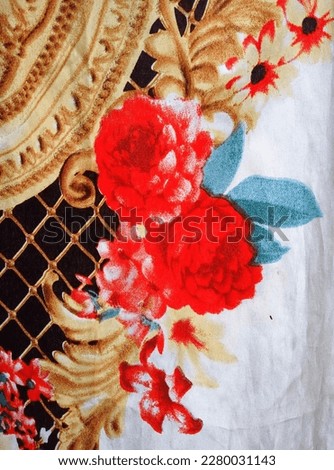 Closeup of embroidered cloth.  floral pattern
