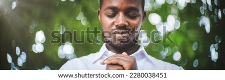 African man prayer in white shirt pray and faith in christianity religion