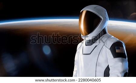 Spaceman in outer space on Earth planet background. Exploration theme. Elements of this image furnished by NASA.