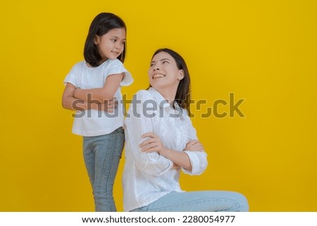 Picture of mother and little daughter showing love for each other by hugging Smile and play happily together.
