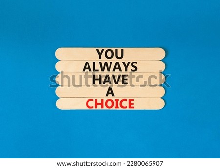 You always have choice symbol. Concept words You always have a choice on wooden stick. Beautiful blue table blue background. Business you always have choice concept. Copy space.