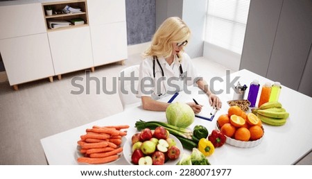 Nutritionist Food Dietician In Office. Female Nutrition Doctor