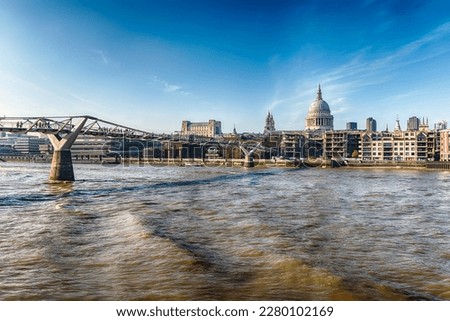 Scenic panoramic view over the river Thames and the skyline with Millennium Bridge and some of the major landmarks in London, England, UK