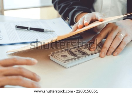 Corruption concept,Business man passing money dollar bills corruption bribery to businessman manager Royalty-Free Stock Photo #2280158851