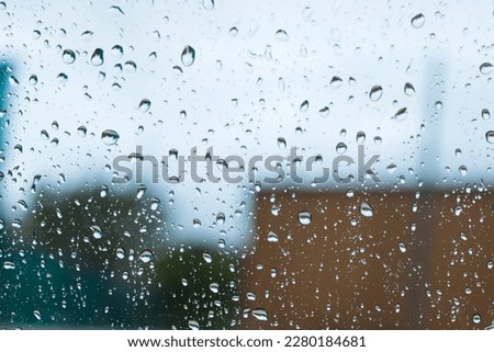 Rainy day view from the window in the car mood of sadness and silence. Raindrops on the glass