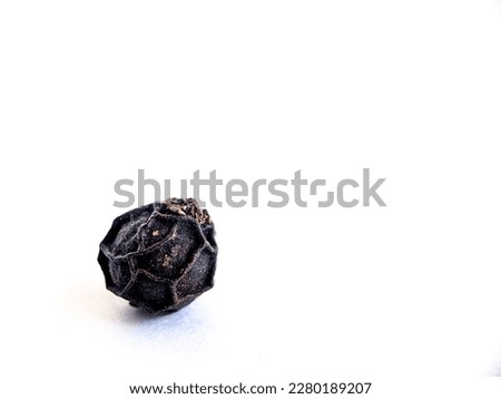 closeup picture of small black peppers seed