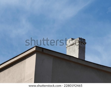 Rooftop, part of the building, construction.Light and shadow. Blue sky.