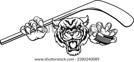 A tiger ice hockey player animal sports mascot holding a hockey stick and puck