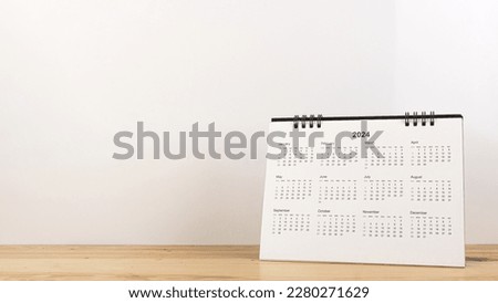 Calendar year 2024 schedule on wood table white background.
2024 calendar planning appointment meeting concept. copy space.