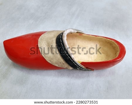 Big red dutch wooden shoe close up. Wooden shoe.