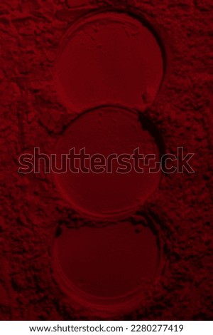 Red texture. Powder background. Pedra, sand. Red color. Dark red. Intense dark red. Cracks, waves, lines, circles, depressions. convex. Banner, advertising, for inscription
