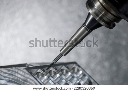 Close up scene the 5-axis machining center cutting the V8 engine cylinder block with solid ball end mill tool. The hi-precision automotive manufacturing process by multi-axis CNC milling machine. Royalty-Free Stock Photo #2280320369