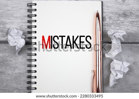 MISTAKES text concept with compressed wads of paper. Learn from mistakes, experience from mistakes. Royalty-Free Stock Photo #2280333495