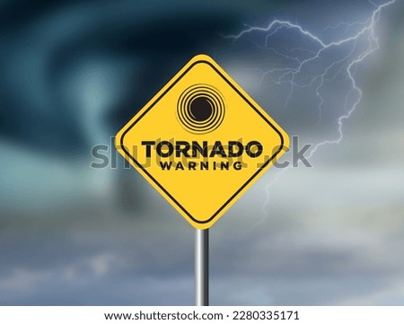 Tornado warning sign against a powerful stormy background with copy space. Dirty and angled sign with cyclonic winds add to the drama. Royalty-Free Stock Photo #2280335171