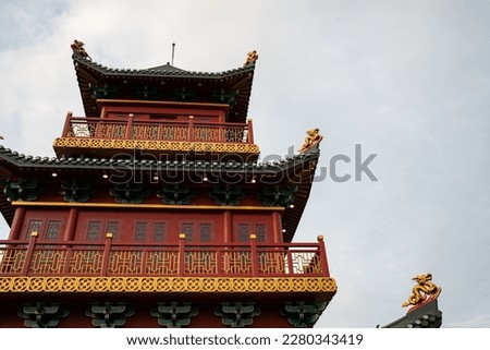 a red Buddhist temple built magnificently with 5 floors in the old shanghai area of jakarta