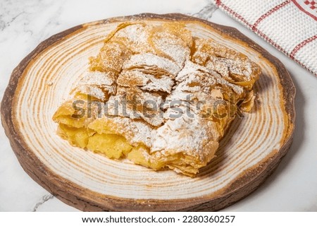 Greek pastry Bougatsa with phyllo dough and semolina custard cream.