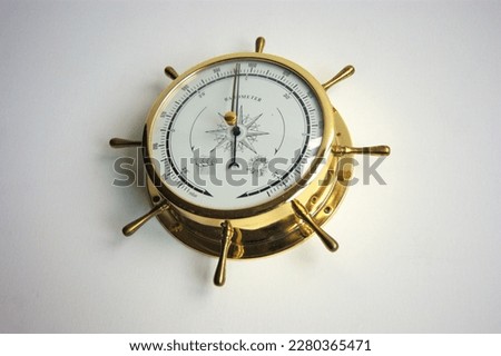 Brass barometer in maritime style, Royalty-Free Stock Photo #2280365471