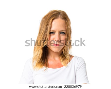 Girl with her arms crossed over white background