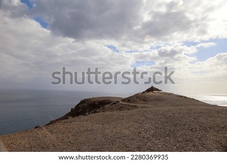 Panoramic view of the Cuchillos de Vigán and the desert land over the Atlantic ocean in Fuerteventura