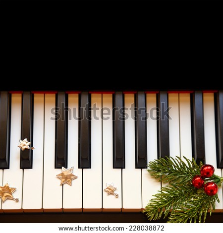 Christmas branch on piano keys