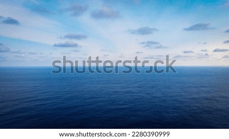 Beautiful drone view of blue ocean dan warm blue sky. Aerial view of The Indian ocean. Calm vast Indian ocean. Royalty-Free Stock Photo #2280390999