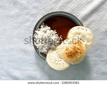Sajer Pitha or Chitoi Pitha, one of traditional food of Bangladesh. Chitoi pitha, coconut and date molasses on white background. Which is made in home on the occasion of Poush Parbon
#uniquesself Royalty-Free Stock Photo #2280401081