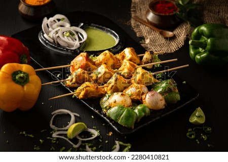 Paneer tikka is a popular vegetarian appetizer that originated in India. Royalty-Free Stock Photo #2280410821