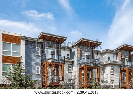 New residential townhouses. Modern apartment buildings in Canada. Modern complex of apartment buildings. Concept of real estate development, house for sale and housing market Royalty-Free Stock Photo #2280412817
