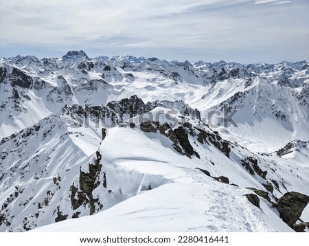 Ski tour in the beautiful swiss alps. Enjoy the beautifully snowy and untouched mountain landscape. Skitour in Davos Klosters Mountains. High quality photo