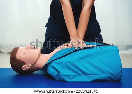 CPR Training ,Emergency and first aid class on cpr doll, Cardiopulmonary resuscitation, One part of the process resuscitation on unconscious person. Royalty-Free Stock Photo #2280421541