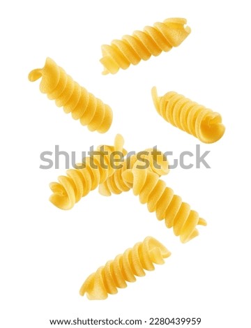 Falling raw Fusilli, Rotini, uncooked Italian Pasta, isolated on white background, clipping path, full depth of field Royalty-Free Stock Photo #2280439959
