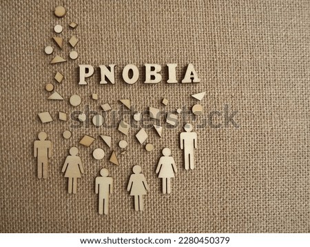 mental illness-phobia in the form of wooden letters and figures of people on a jute background. High quality photo
