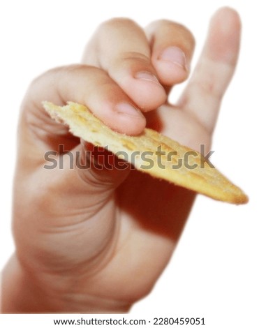 Hand holding cracker isolated on white background