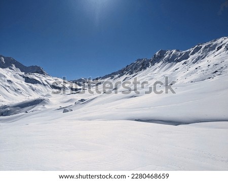 Ski tour on the big mountains above davos with a view of the Fluelapass hospiz. Flueela pass. Ski mountaineering in a breathtaking winter landscape. High quality photo