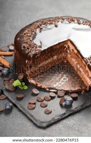 Cake decoration. Chocolate glaze. Chef decorated pie. Homemade baking concept Royalty-Free Stock Photo #2280476915