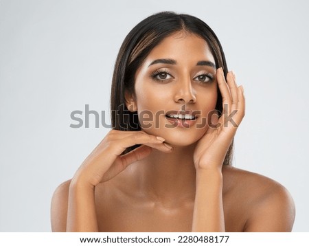 Beautiful Girl Facial Skin Care. Smiling Indian Model with Perfect Eyes Make up isolated White. Women Beauty Spa Cosmetology and Treatment. Face Lift and Dermal Filler Cosmetics