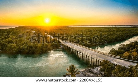 Aerial sunset with the bridge between Sugarloaf and Saddlebunch Keys, above Sugarloaf Creek, in Florida Keys, Florida. Royalty-Free Stock Photo #2280496155