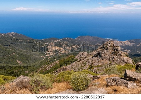 High angle view from summit station of Monte Capanne cable car to mountain village Marciana Alta and bay of Marciana Marina, Island of Elba, Italy Royalty-Free Stock Photo #2280502817