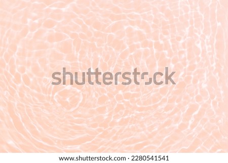 Defocus blurred transparent cream-colored clear calm water surface texture with splashes and bubbles. Trendy abstract nature background. Water waves in sunlight with ivory. Eggshell color water shine