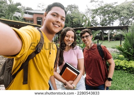 Group of university students taking a selfie.