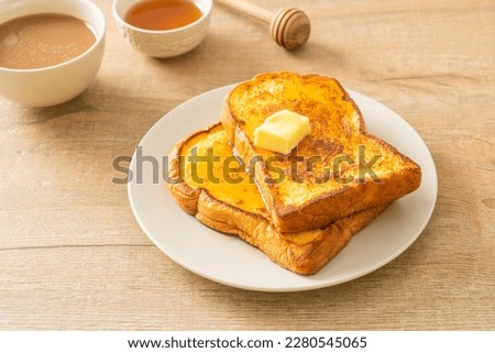 French toasted with butter and honey for breakfast Royalty-Free Stock Photo #2280545065