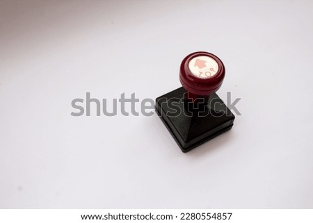 Hand stamp with top directions on isolated white background.