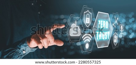 Zero trust security concept, Person hand touching zero trust icon on virtual screen. with blue bokeh background Royalty-Free Stock Photo #2280557325