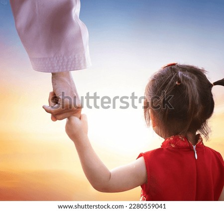 Father in the Heaven concept, Father holds daughter by the hand Royalty-Free Stock Photo #2280559041